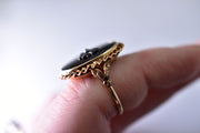 Vintage Statement Ring with Onyx Face and Silver Floral Center